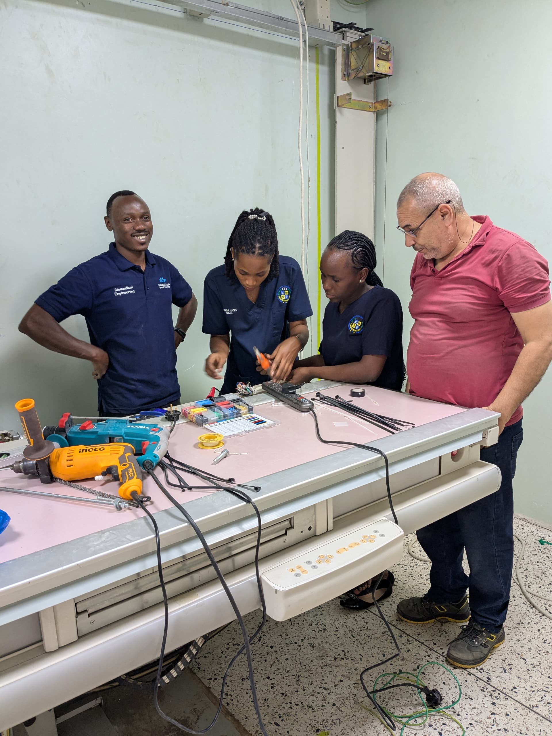 Biomedical engineers installing hospital equipment
